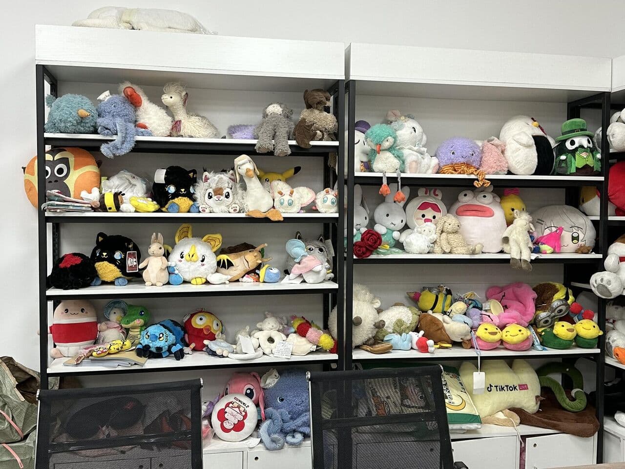 Shelves of finished custom plush toys at Bella plush toy factory